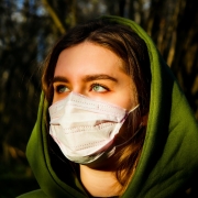 discerning woman with mask